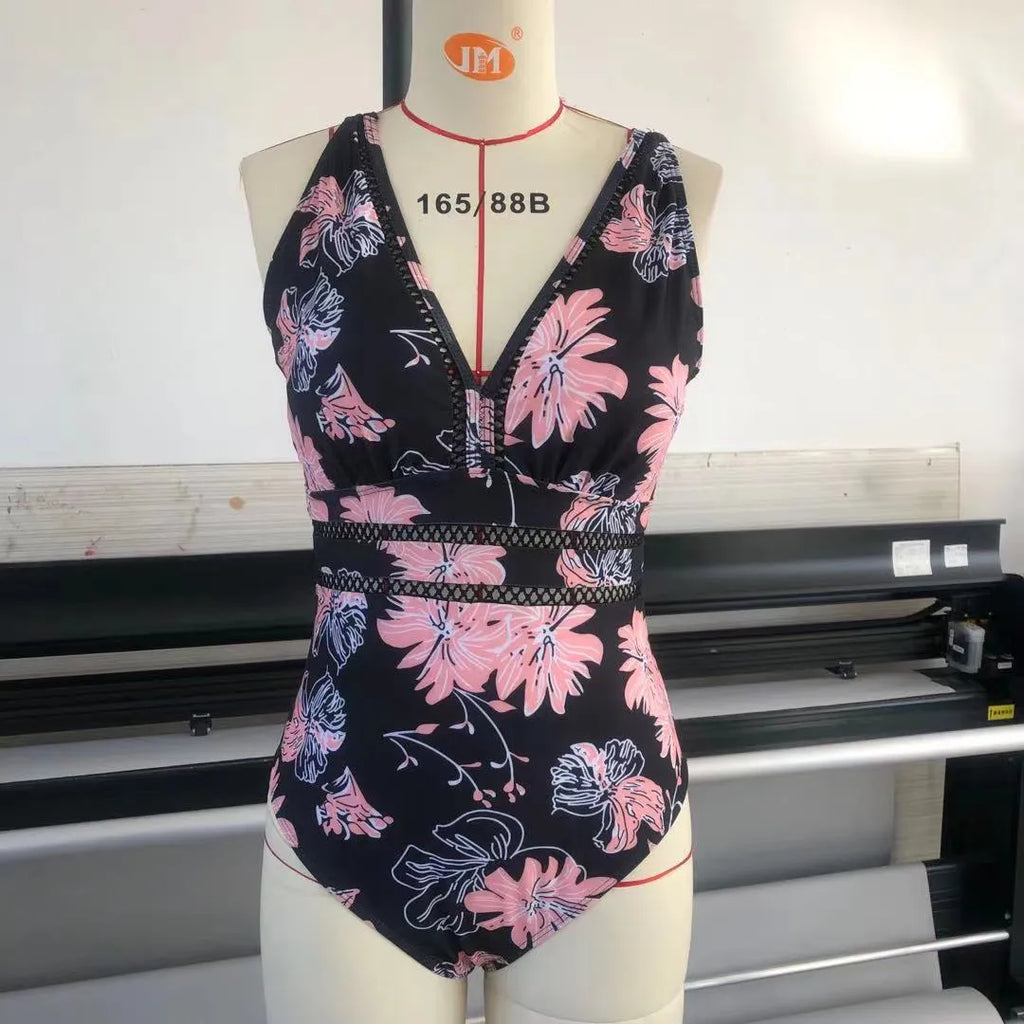 Black printed plus size women's bikini swimsuit with mesh stitching, shown on a model.