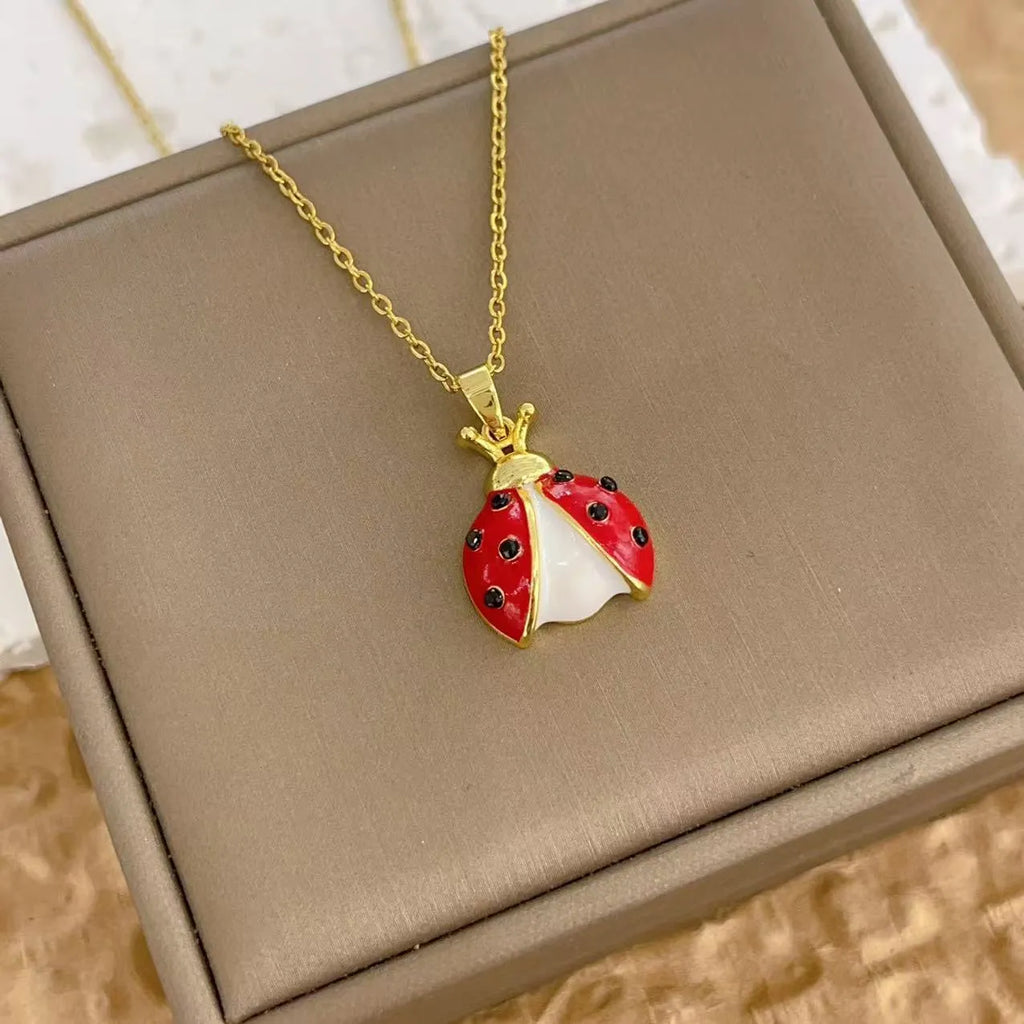 Ladybug pendant necklace with seven-spotted beetle charm, mixed gemstone inlay and copper O-link chain, 41-50cm.