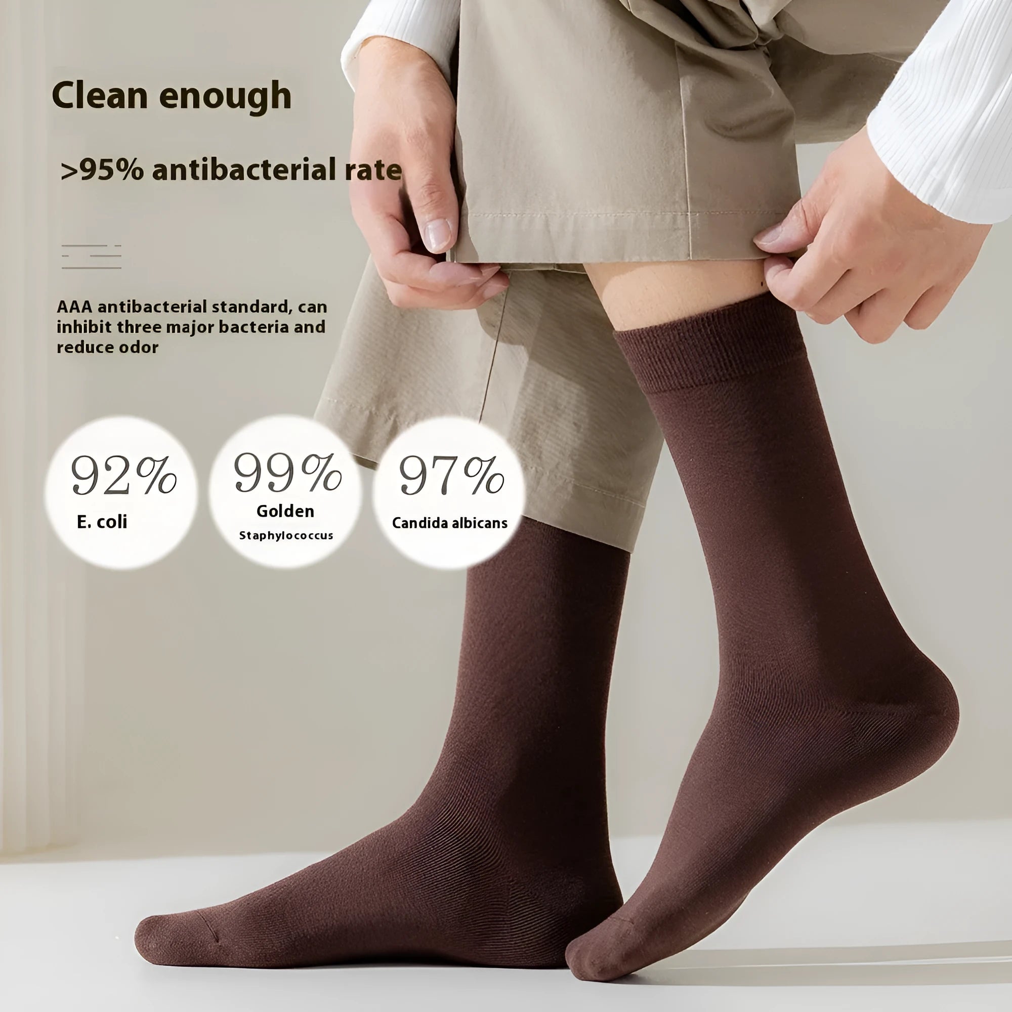 Men's mid-calf length solid colour business socks in combed cotton on a white background.