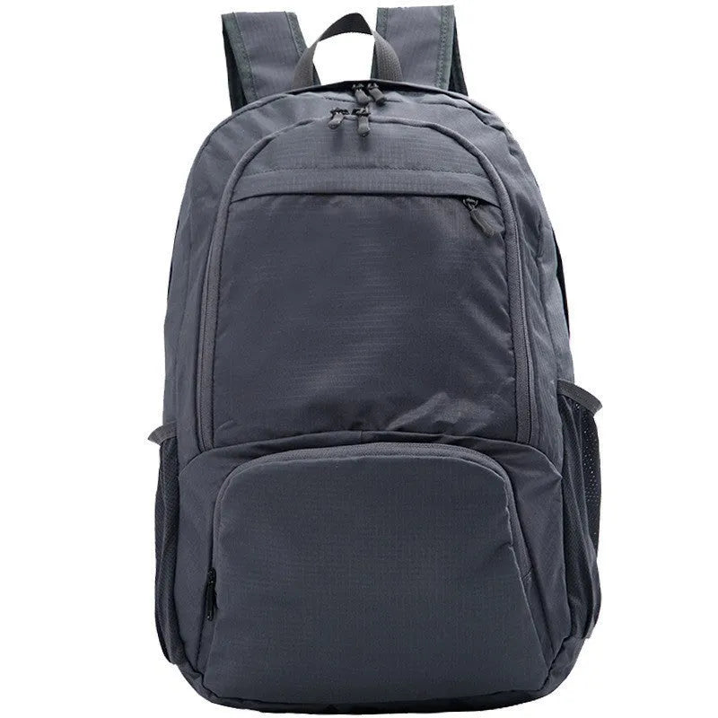 A 26-inch waterproof Oxford cloth backpack in a solid colour, shown folded and unfolded.