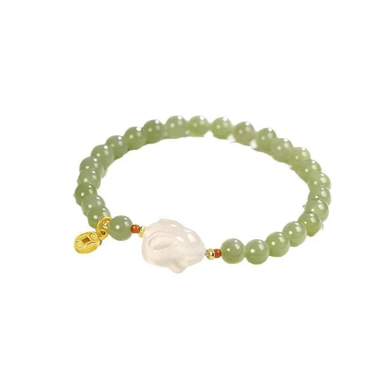Handmade women's bracelet with a glass band and a choice of rabbit charm, presented in a gift box.