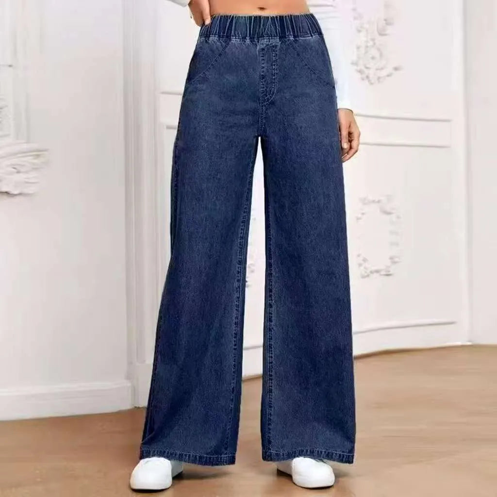 Light blue washed wide-leg plus size straight jeans with mid waist zip fly