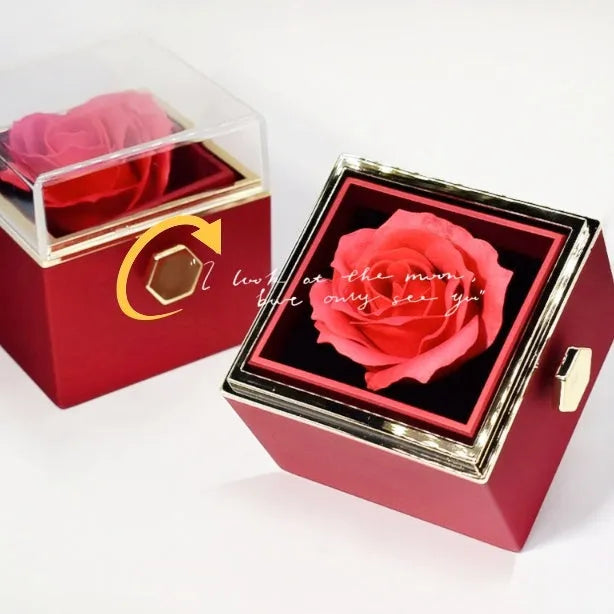 Rotating jewellery box with preserved red rose under acrylic cover and drawer open showing storage