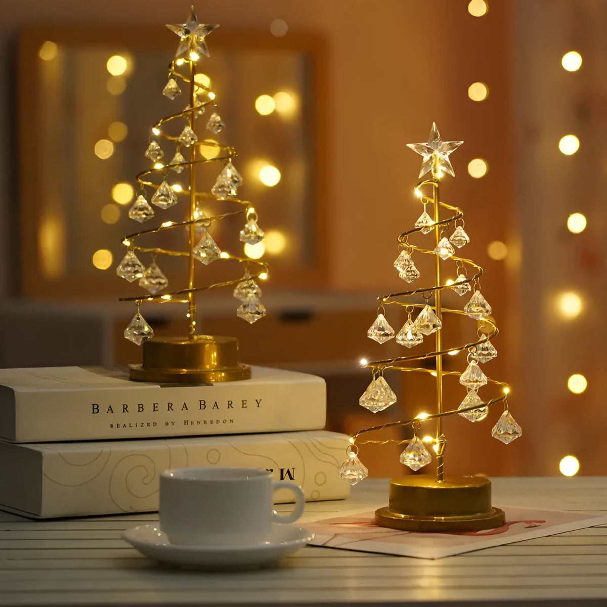 Gold crystal Christmas tree LED light with battery-powered warm glow on a shelf
