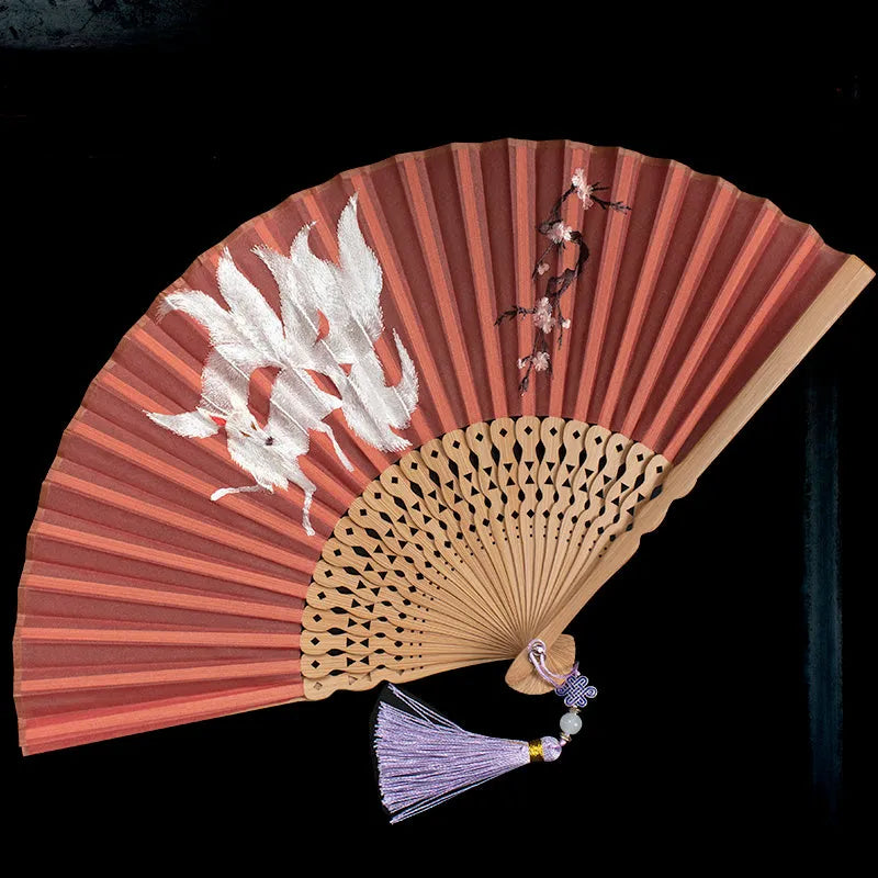 7-inch bamboo folding silk embroidered fan showing traditional Chinese embroidery designs