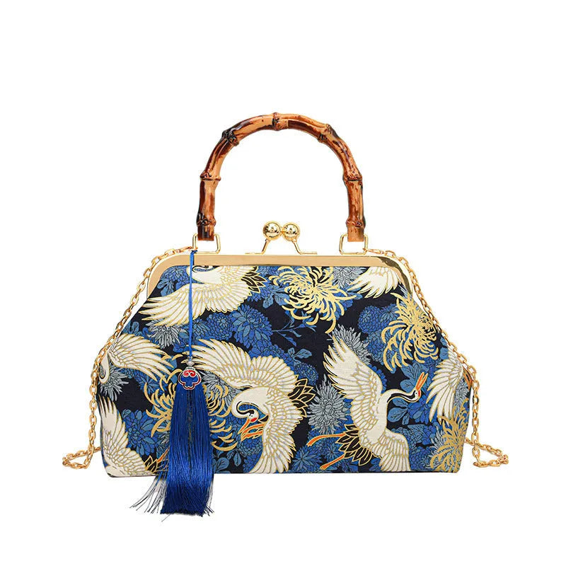 Canvas shell shape crossbody bag with ethnic embroidery, 27cm x 17cm x 7cm, available in black