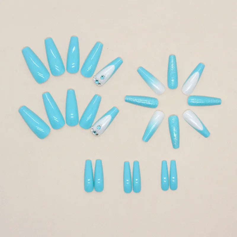 Long ballet-shaped false nails with blue diamond glitter, includes glue.
