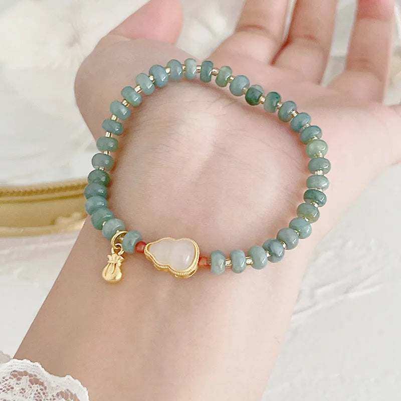 Natural blue water Hetian jade bracelet with carved gourd charm and engraved peace buckle