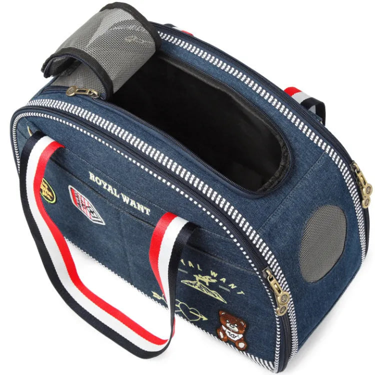 Blue denim pet diaper bag with cartoon patterns measuring 43cm by 20cm by 30cm
