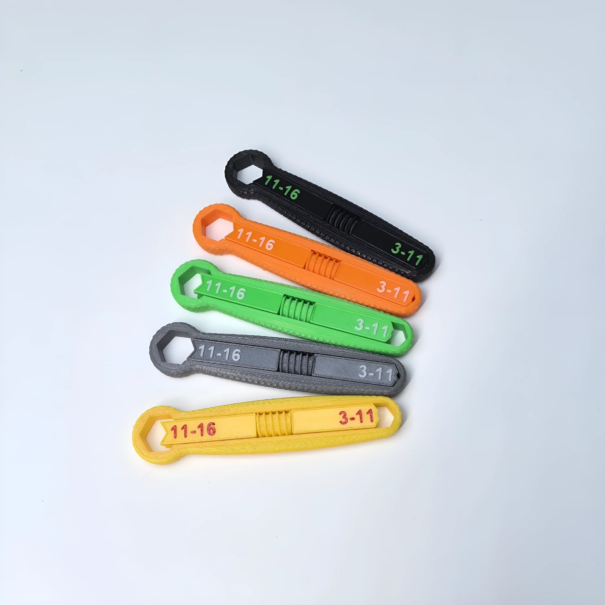 Portable multi-function plastic hand exercise tool in gray for finger strength training