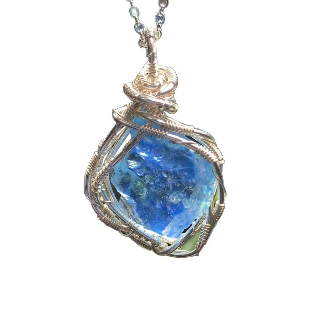 Natural raw aquamarine stone pendant hand-wrapped in gold copper wire with starry sky design