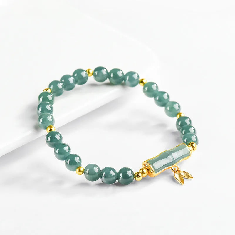 Women's high-rise bracelet with blue water round jade beads on S925 silver.