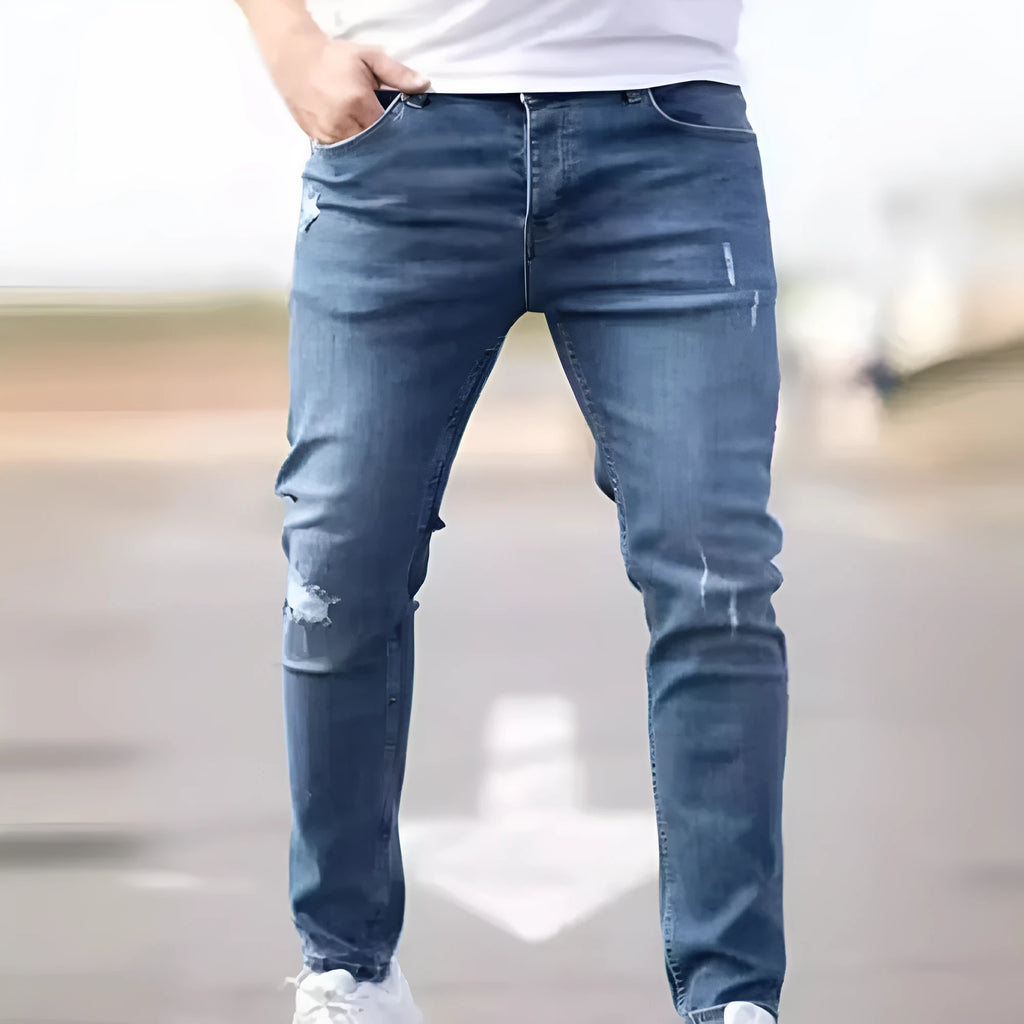 Men's blue denim skinny jeans with medium stretch, cotton fabric, side view on mannequin