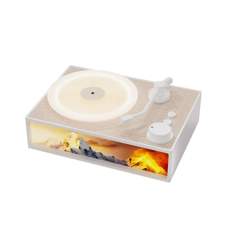 Light Painting Aromatherapy Bluetooth Speaker in elegant white with plastic casing and lighting effects on desktop