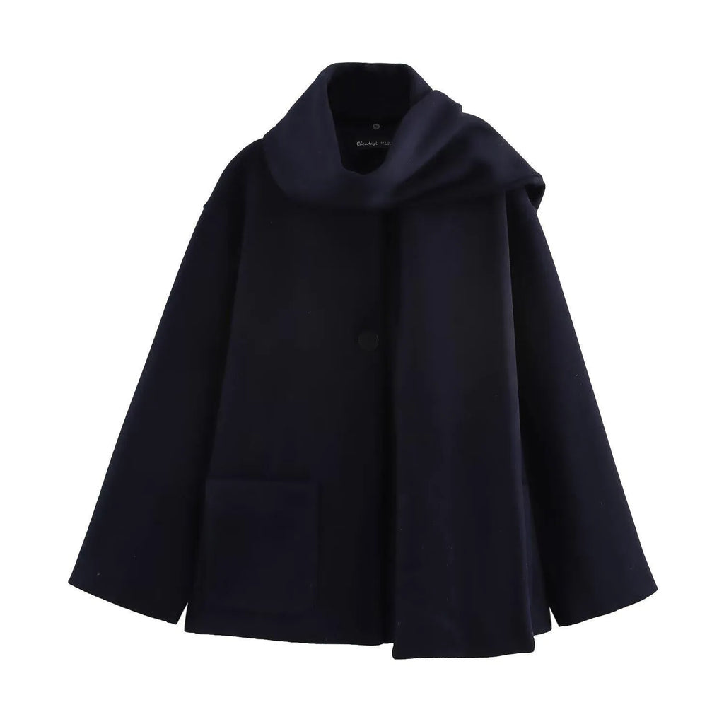Women's long grey coat with artificial fur collar and street fashion styling