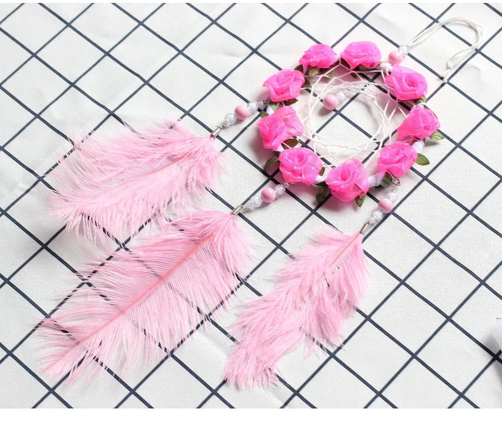 Pink ostrich feather dreamcatcher wind chime measuring 10cm for wall decoration