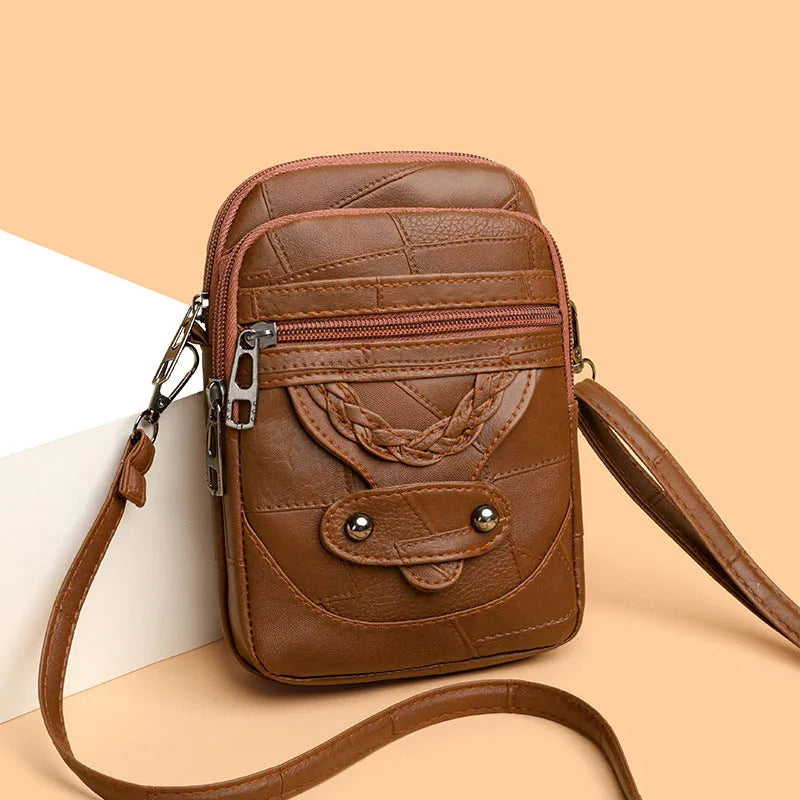 Soft brown PU leather vertical mobile phone bag with weaving pattern and metal rivets.