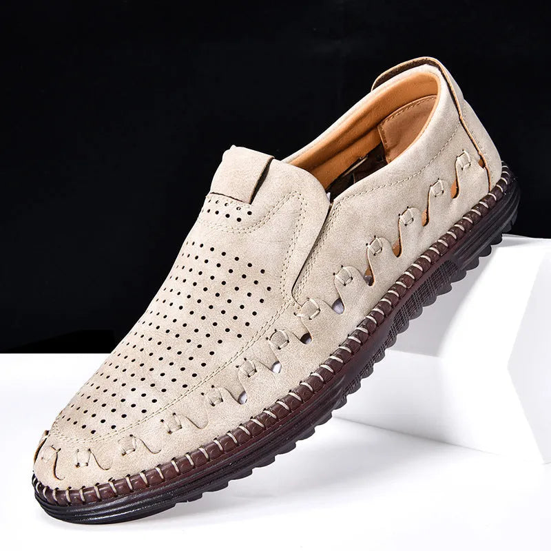 Men's brown slip-on casual shoes with a round toe and flat heel, showing hollowed-out design details.