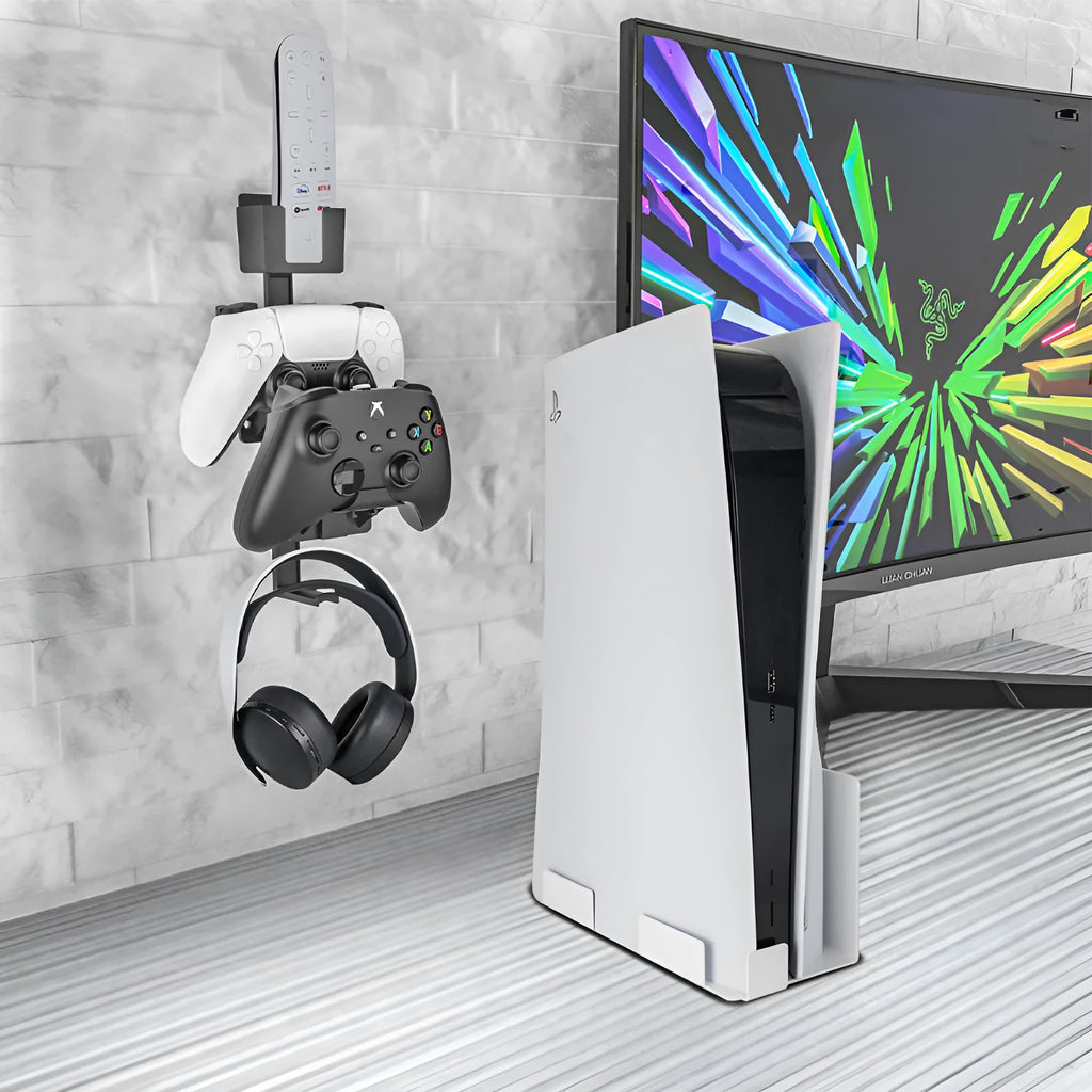 White wall-mounted hook holding a PS5 controller and gaming headset.