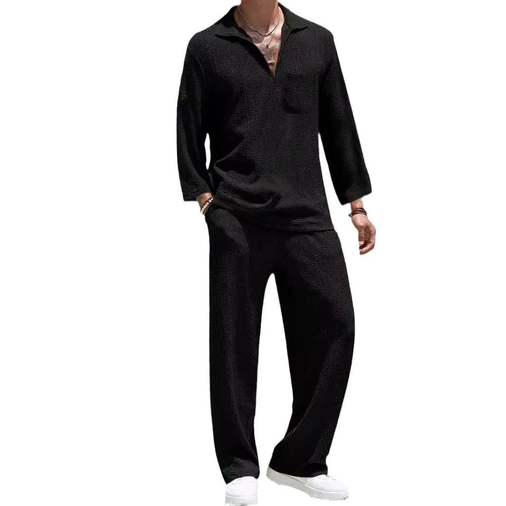 Man wearing a lake blue casual shirt and trouser suit set for autumn leisure.