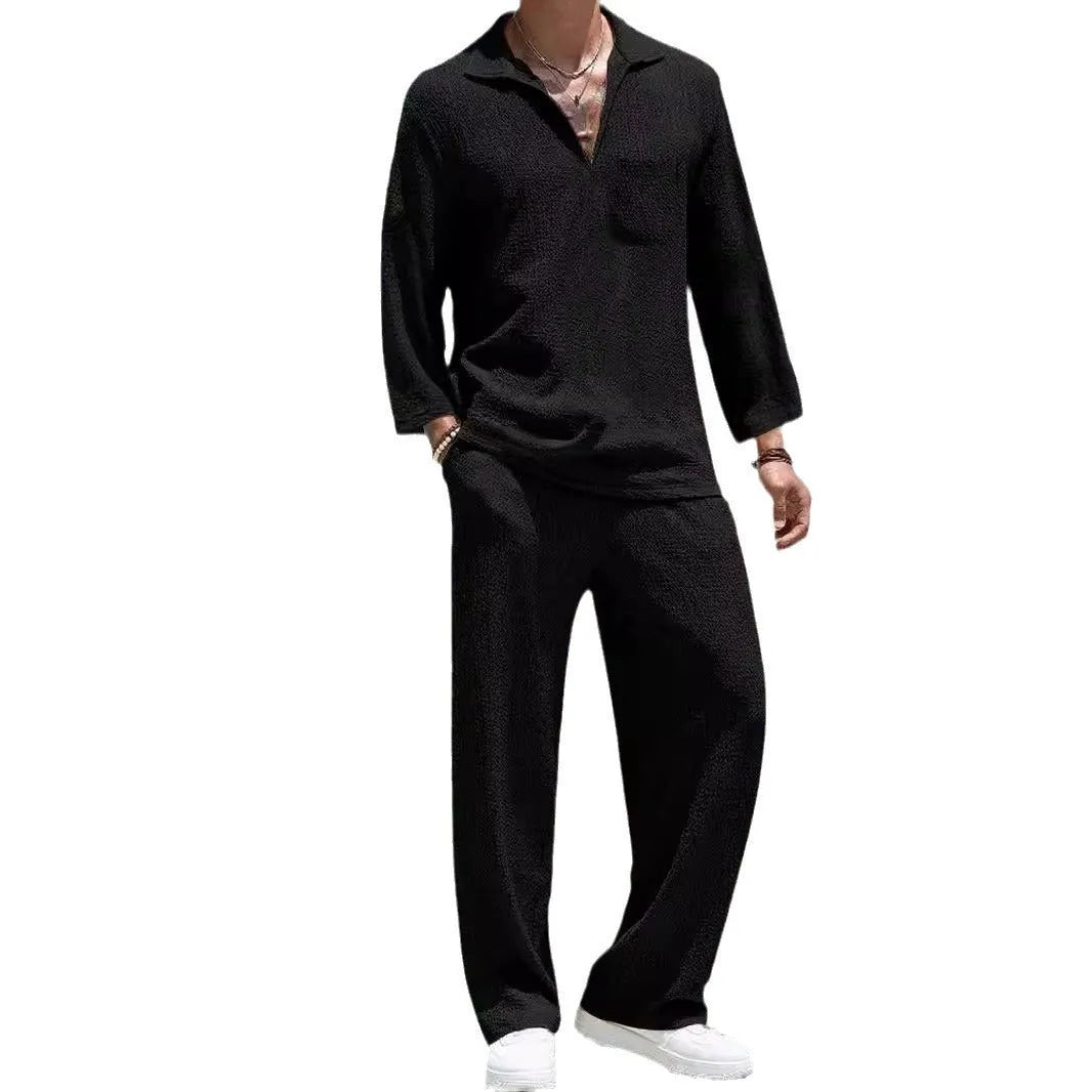 Man wearing a lake blue casual shirt and trouser suit set for autumn leisure.
