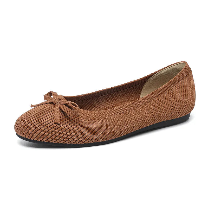 Women's butterfly print flat fabric pumps with round toe and flat heel on a white background.