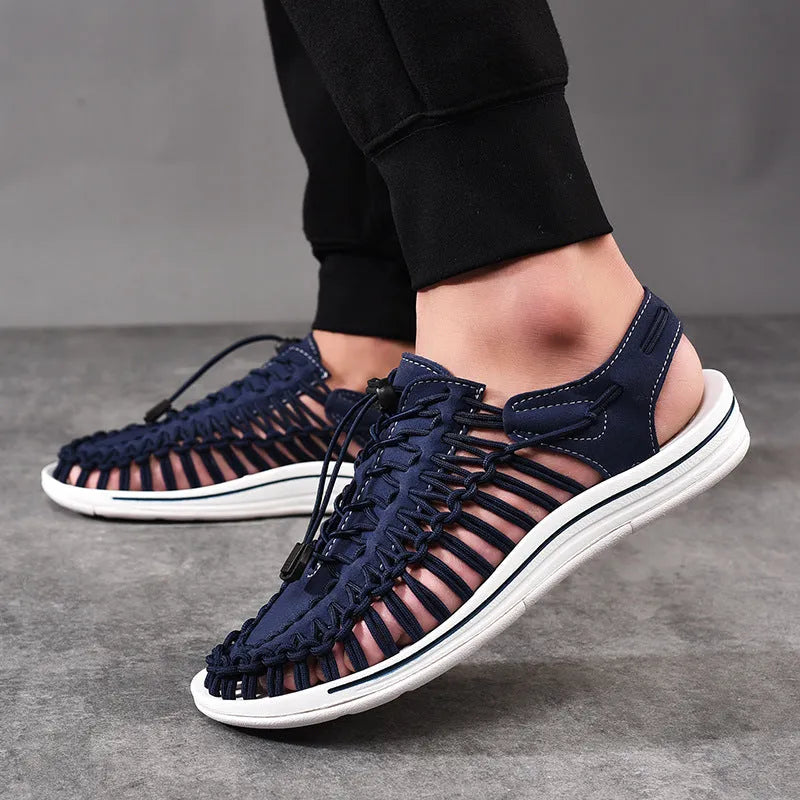 Adjustable drawstring tie woven sandals in multiple colours on a non-slip rubber sole.