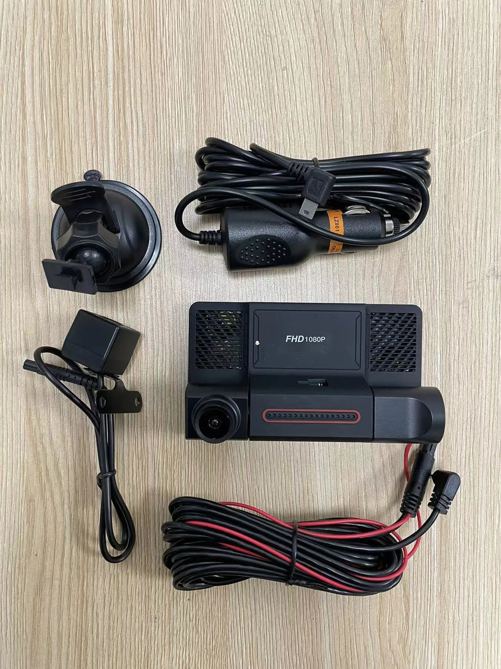 Black three lens dashboard camera with 4 inch screen for front and rear vehicle monitoring