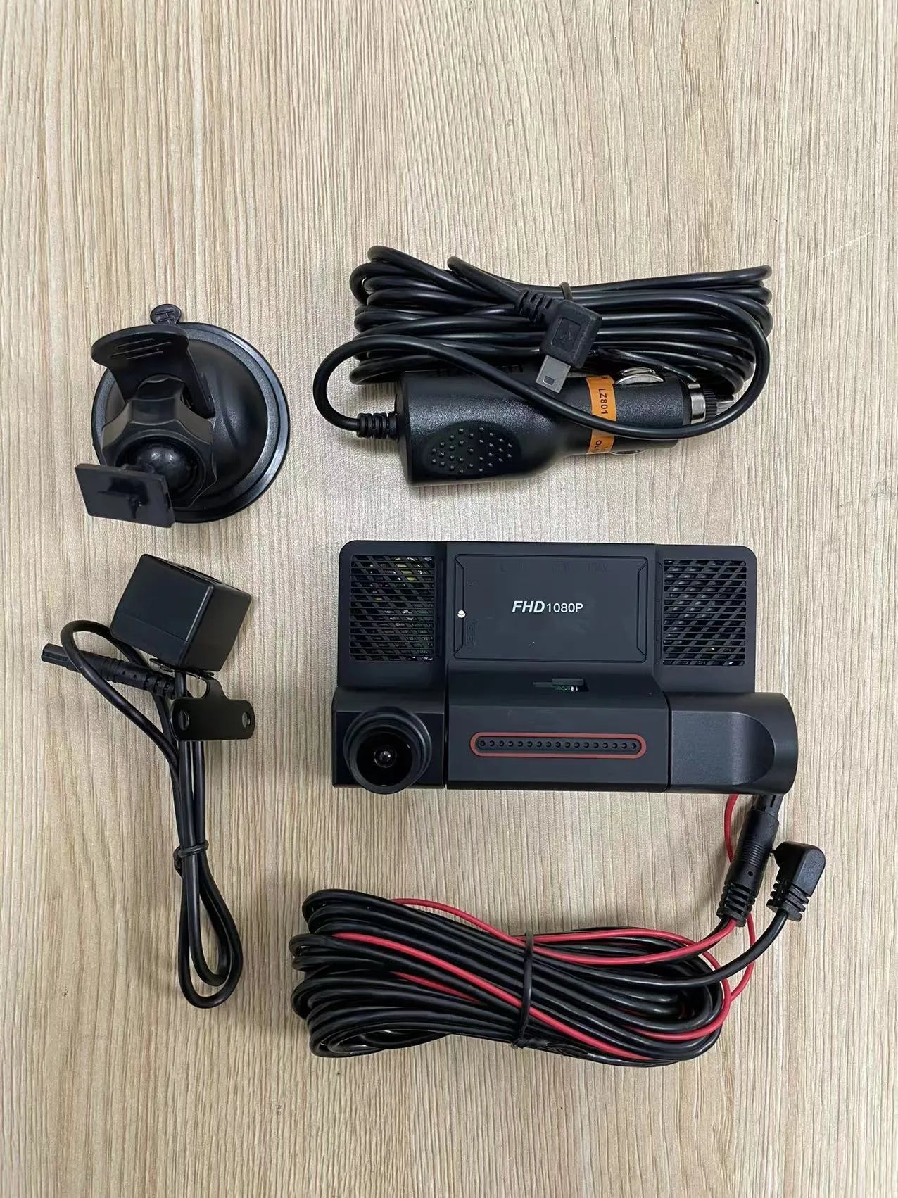 Black three lens dashboard camera with 4 inch screen for front and rear vehicle monitoring