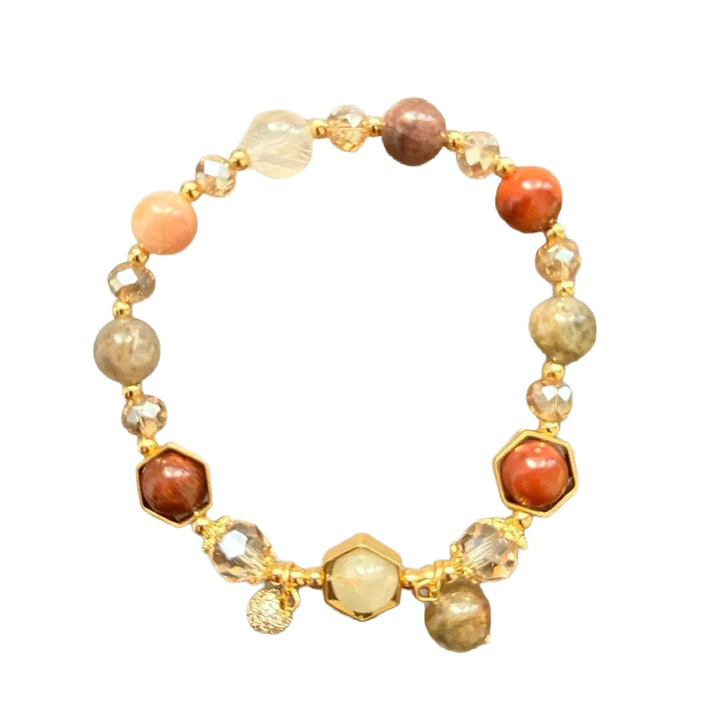Gold-coloured citrine bracelet with hand-woven construction showing auspicious Chinese symbols