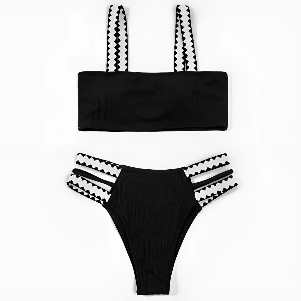 Black women's hollowed-out split swimsuit bikini set on a mannequin.