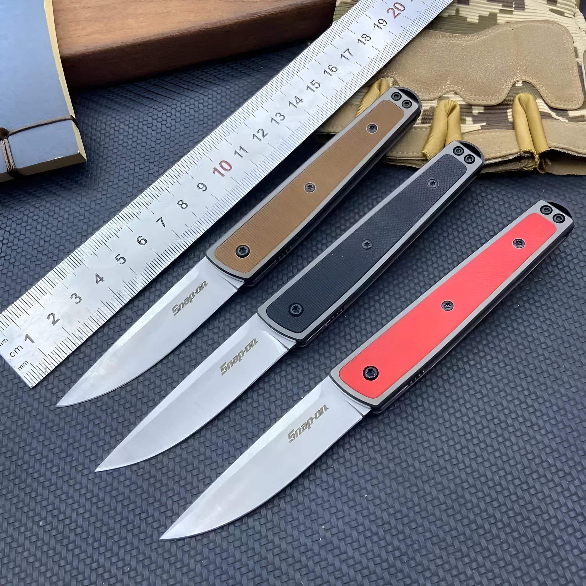 Folding fruit knife with stainless steel blade shown in black, red, and coffee colour variations