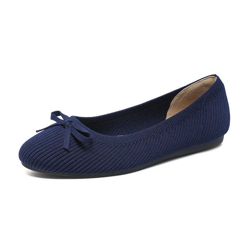Women's butterfly print flat fabric pumps with round toe and flat heel on a white background.