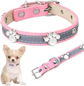 Reflective adjustable PU leather dog collar with metal paw rivet on a grey background.