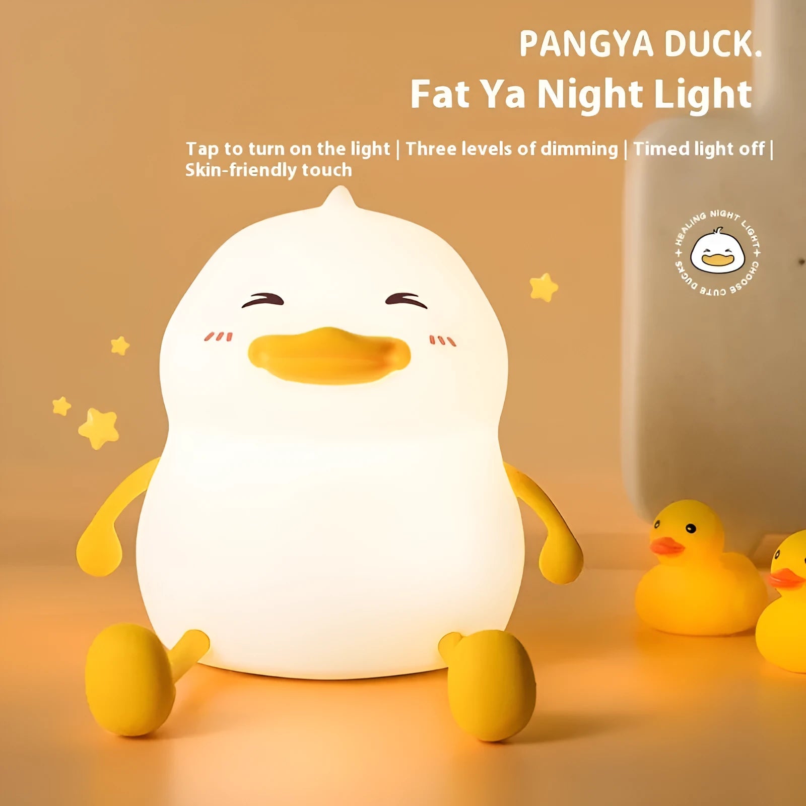 Chubby white silicone night light on a desk holding a mobile phone, showing touch controls and USB port.