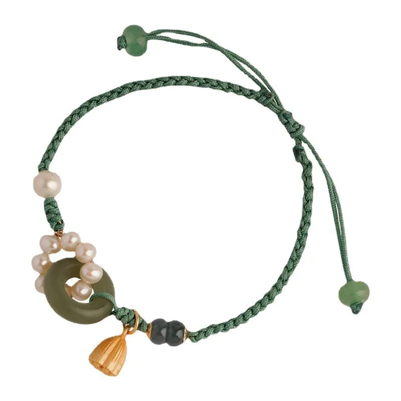 Hand-woven round watch band made from flexible wire with a Pearl Peace Buckle clasp