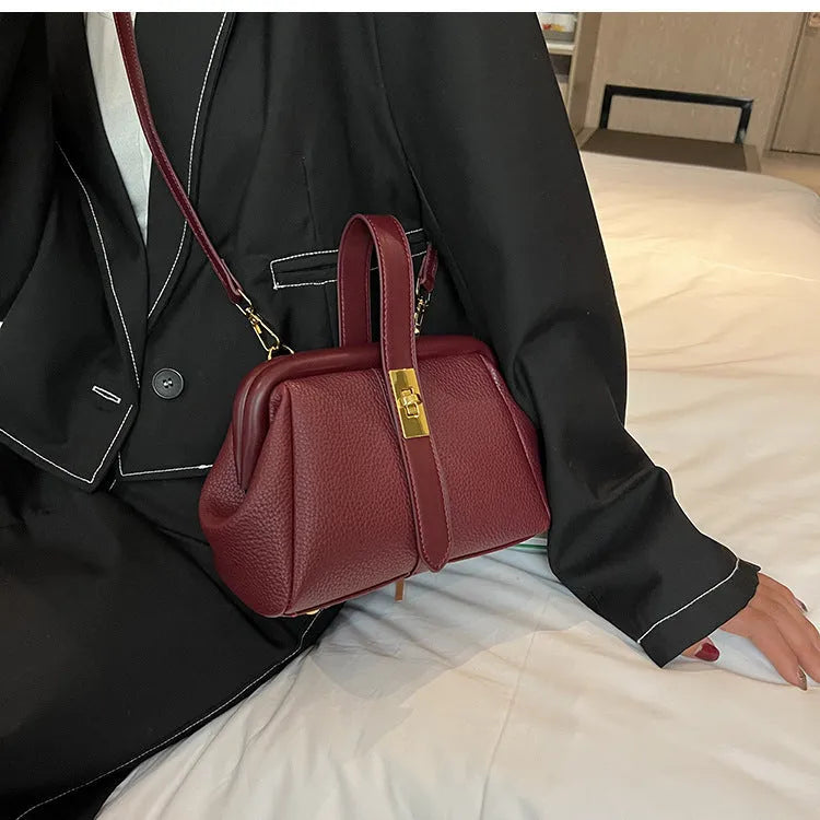 PU leather shoulder bag in cross-square shape with visible sewing line detail, available in four colours