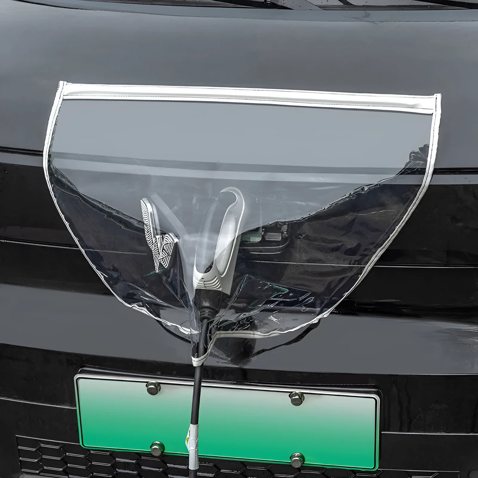 Black electric vehicle charging rain cover with magnetic strips unfolded to show 60cm x 50cm size