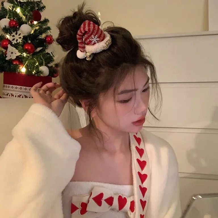 Plush Christmas hair accessory for women with jingling bell, available as headband or duckbill clip