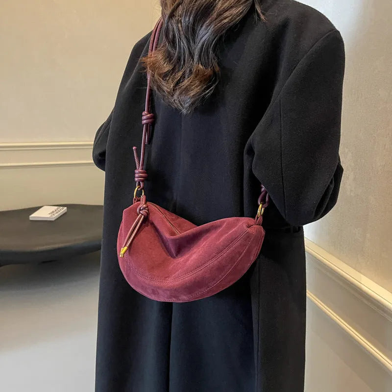 Soft PU leather crossbody underarm dumpling bag in black with sewing line detail and sandwich pocket