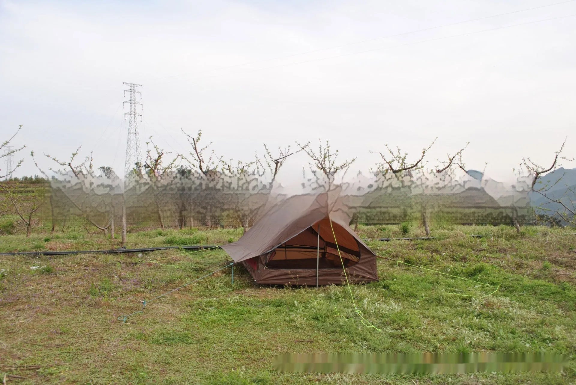 Brown or white A-line pole-free cabin tent for 2-3 people with hiking cane setup.