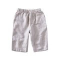 Men's light grey linen trousers with a loose straight-leg fit on a plain background.