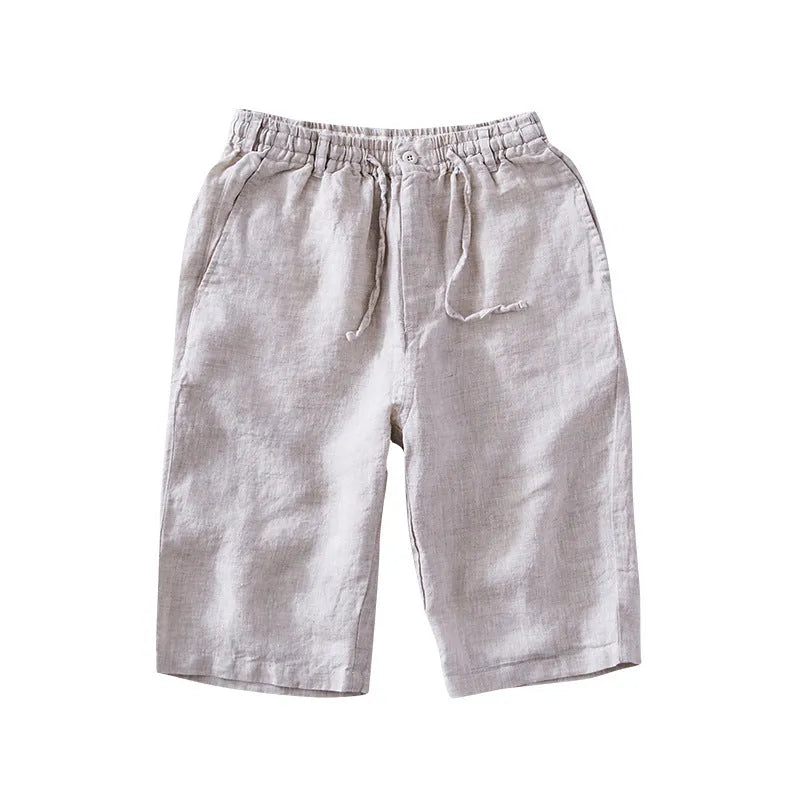 Men's light grey linen trousers with a loose straight-leg fit on a plain background.