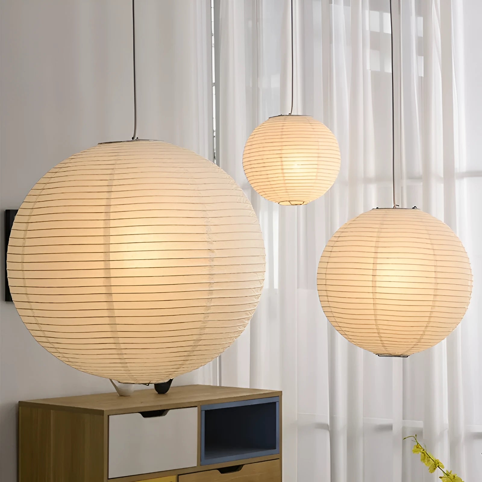Modern simplicity style paper pendant chandelier lamp with a flat round shade.