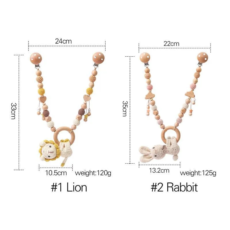 Baby crib hanging bunny music toy with metal construction in cart chain rabbit colour, showing biteable pendant for infant soothing and development.