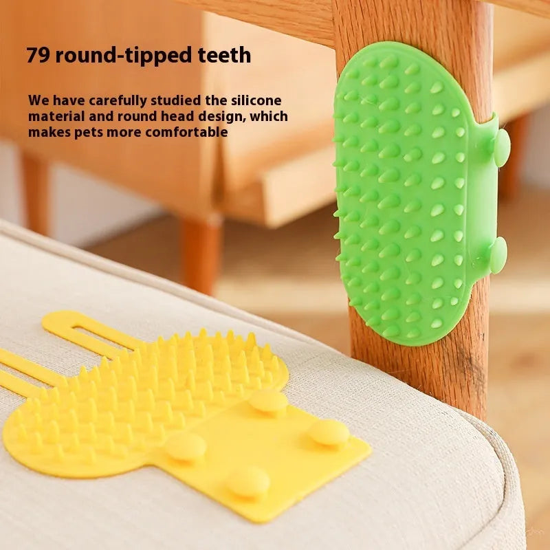Silicone cat grooming comb with adjustable strap mounted on a table leg.