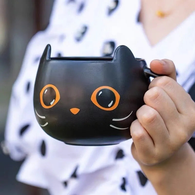 Black ceramic Halloween pumpkin couple mug with 355ml capacity and cat-shaped spoon lid.