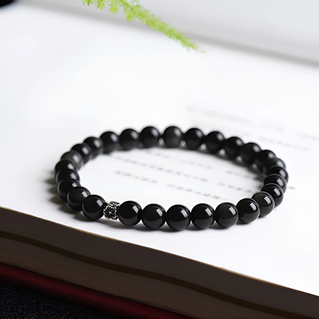 Natural obsidian bracelet with S925 silver flower accessories showing 6mm constellation design and dragon phoenix decorations