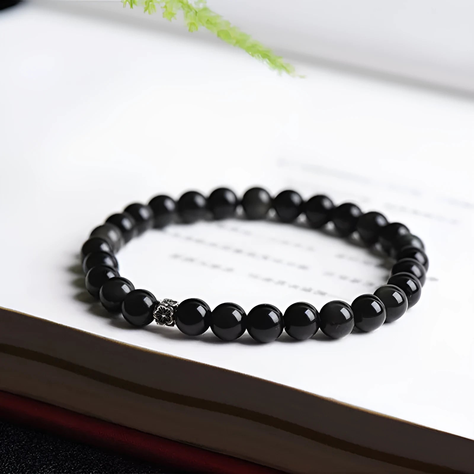 Natural obsidian bracelet with S925 silver flower accessories showing 6mm constellation design and dragon phoenix decorations