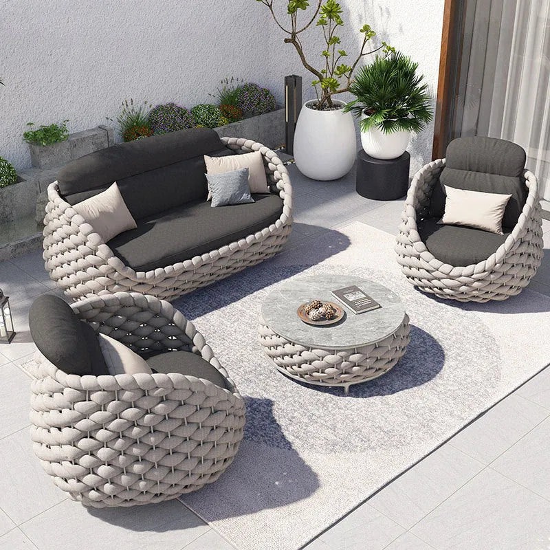 Outdoor patio lounge sofa coffee table set with PE rattan weave, aluminium frame, and high-density sponge cushions.